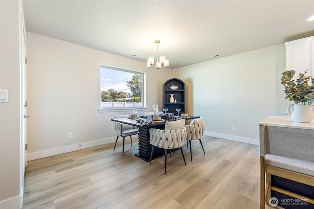 4208 W Sandy Ct, Moses Lake, WA 98837 - dining room with a chandelier, an office area, and light wood-type flooring