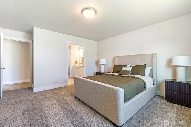 4208 W Sandy Ct, Moses Lake, WA 98837 - carpeted bedroom with baseboards and connected bathroom