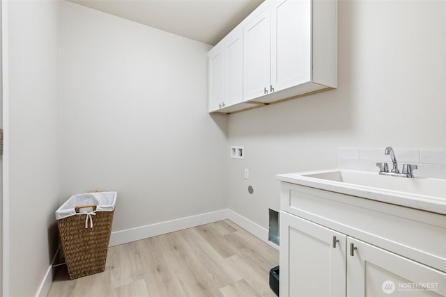 4208 W Sandy Ct, Moses Lake, WA 98837 - washroom with cabinet space, washer hookup, and light wood-style flooring
