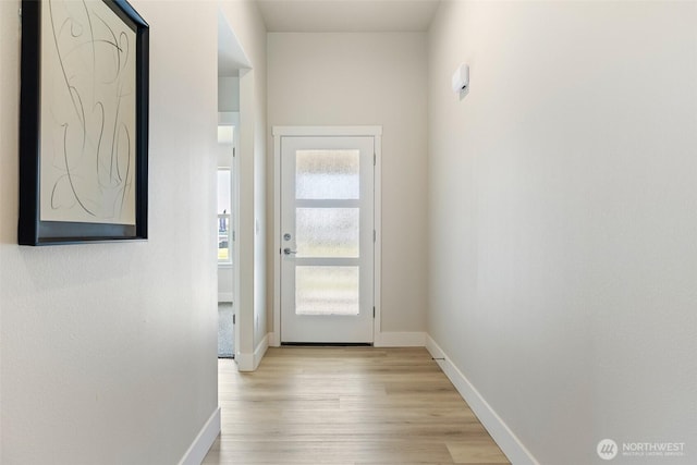 4208 W Sandy Ct, Moses Lake, WA 98837 - doorway to outside featuring light wood-style floors and baseboards