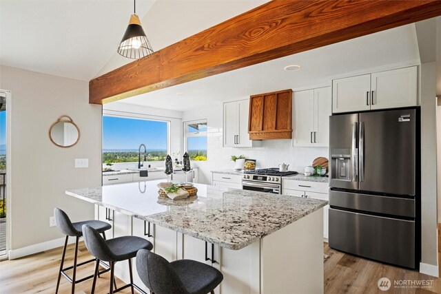3020 Alpine Dr, Bellingham, WA 98226 - kitchen with stainless steel appliances, premium range hood, light wood-type flooring, a center island, and a sink