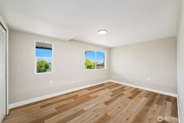3020 Alpine Dr, Bellingham, WA 98226 - unfurnished room featuring baseboards, plenty of natural light, and wood finished floors