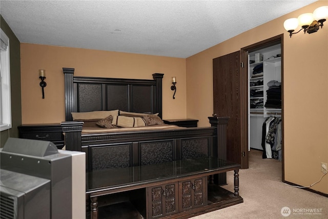 3521 170th Ave E, Lake Tapps, WA 98391 - bedroom with carpet, a walk in closet, a closet, and a textured ceiling
