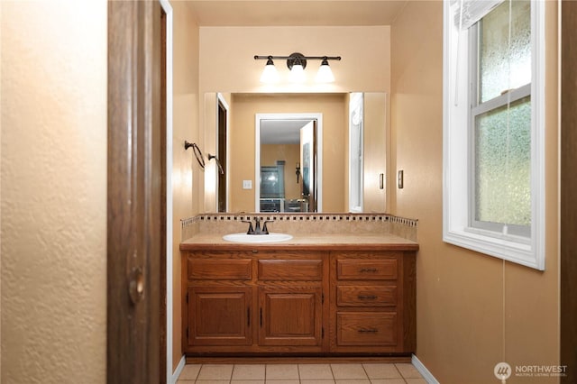 3521 170th Ave E, Lake Tapps, WA 98391 - bathroom featuring vanity, tile patterned flooring, and baseboards