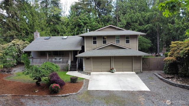 3521 170th Ave E, Lake Tapps, WA 98391 - tri-level home with a porch, concrete driveway, a chimney, roof with shingles, and an attached garage