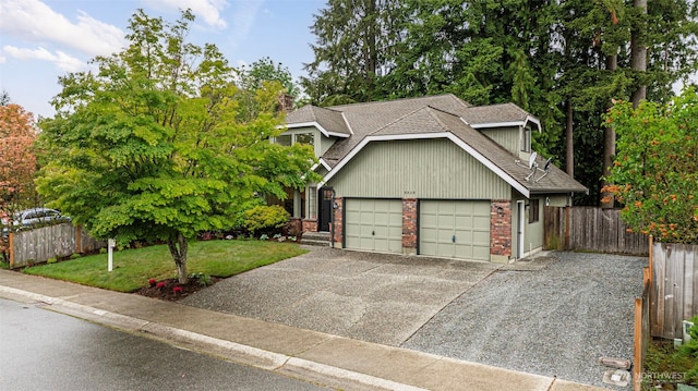9828 33rd Dr SE, Everett, WA 98208 - view of front of house with a garage, concrete driveway, a shingled roof, and brick siding
