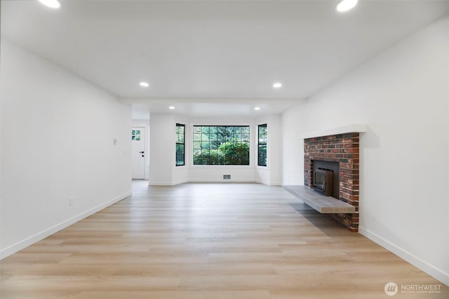 9828 33rd Dr SE, Everett, WA 98208 - unfurnished living room featuring recessed lighting, wood finished floors, and baseboards
