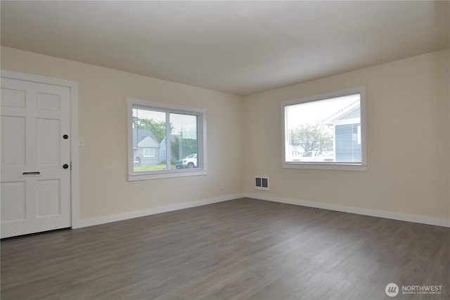 3159 Florida St, Longview, WA 98632 - spare room featuring dark wood-style flooring and baseboards