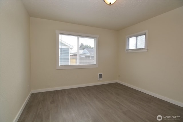 3159 Florida St, Longview, WA 98632 - empty room featuring dark wood-style floors and baseboards