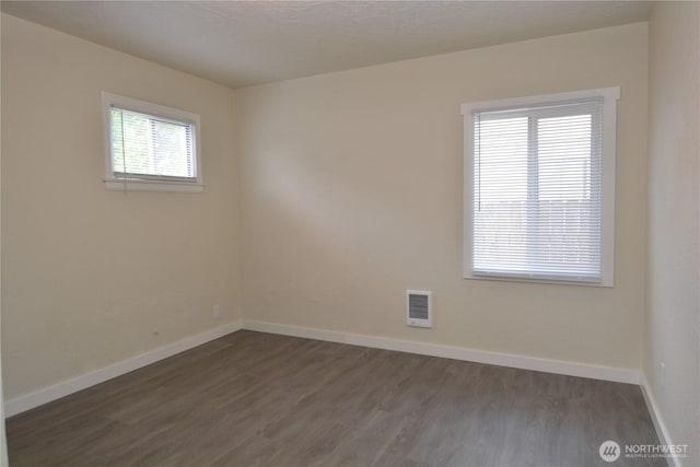3159 Florida St, Longview, WA 98632 - spare room with dark wood-type flooring and baseboards