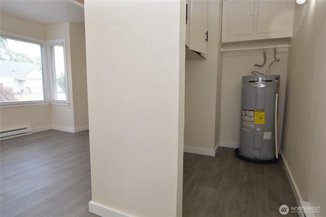 3159 Florida St, Longview, WA 98632 - utility room with strapped water heater and a baseboard heating unit