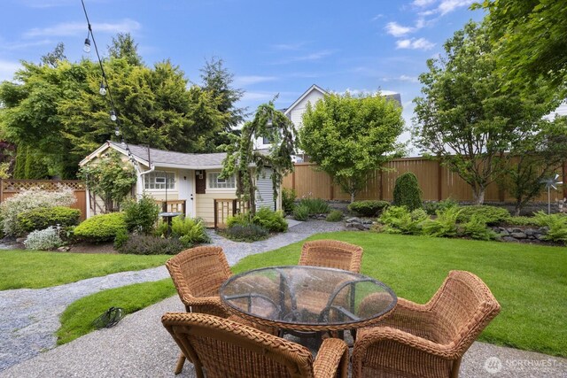 27 148th Pl SW, Lynnwood, WA 98087 - view of yard with an outbuilding, outdoor dining space, and a patio