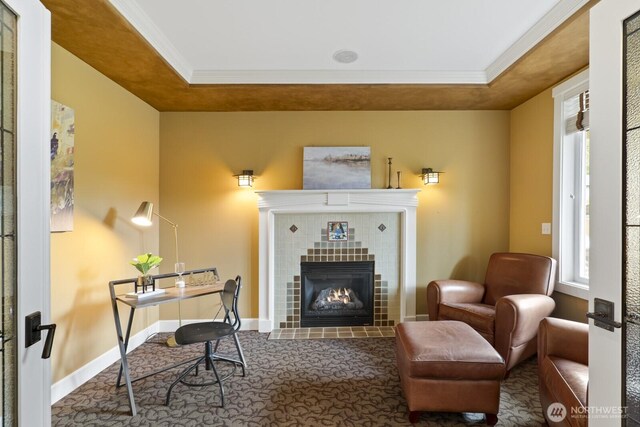 27 148th Pl SW, Lynnwood, WA 98087 - home office with crown molding, a tray ceiling, a tiled fireplace, healthy amount of natural light, and baseboards