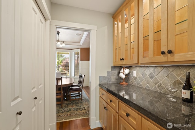 27 148th Pl SW, Lynnwood, WA 98087 - kitchen featuring dark wood-type flooring, tile counters, a raised ceiling, and tasteful backsplash