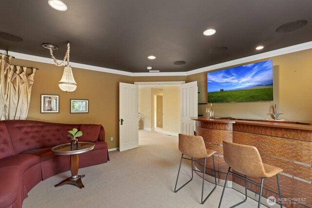 27 148th Pl SW, Lynnwood, WA 98087 - carpeted living room with crown molding, a sink, baseboards, and recessed lighting