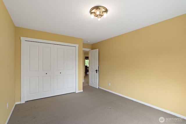 27 148th Pl SW, Lynnwood, WA 98087 - unfurnished bedroom featuring carpet floors, baseboards, and a closet