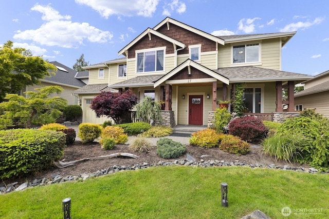 27 148th Pl SW, Lynnwood, WA 98087 - craftsman-style home featuring a front lawn, a shingled roof, and a porch