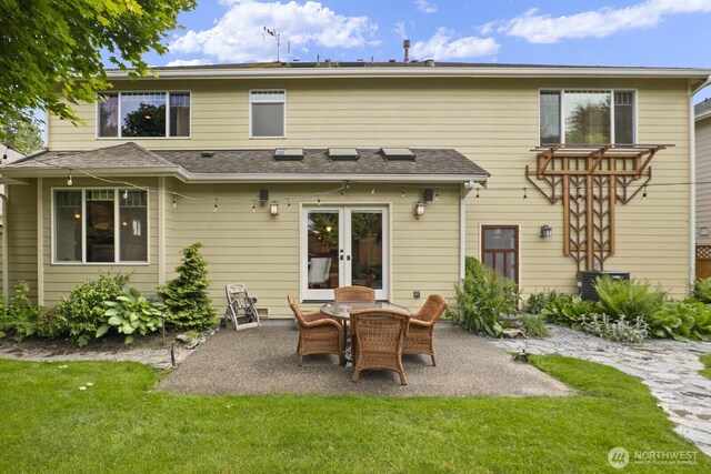 27 148th Pl SW, Lynnwood, WA 98087 - back of house with a patio, a lawn, and french doors