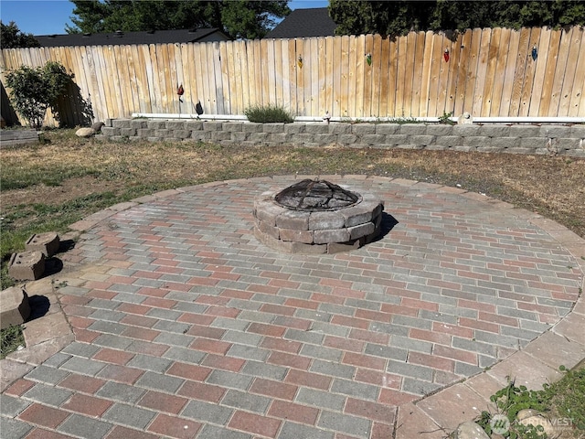 239 SE H St, Ephrata, WA 98823 - fenced backyard with a patio area and an outdoor fire pit