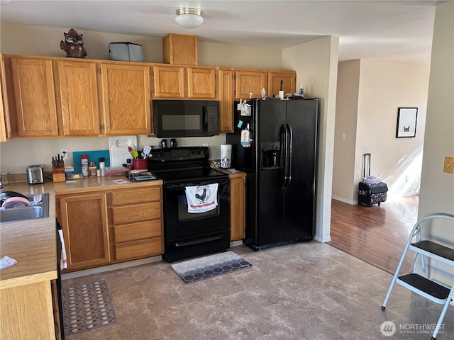 239 SE H St, Ephrata, WA 98823 - kitchen with black appliances, light countertops, and a sink