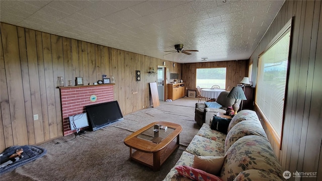 1296 US Highway 12, Chehalis, WA 98532 - living area featuring light carpet, a ceiling fan, and wood walls