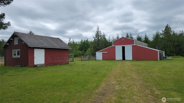 1296 US Highway 12, Chehalis, WA 98532 - view of yard featuring a garage, an outdoor structure, driveway, and an outbuilding