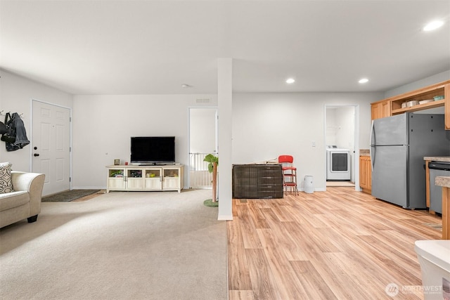 8450 Hazel Ct, Maple Falls, WA 98266 - living room featuring washer / clothes dryer, recessed lighting, and light wood finished floors