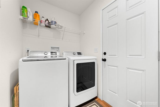 8450 Hazel Ct, Maple Falls, WA 98266 - laundry room with washer and dryer and wood finished floors