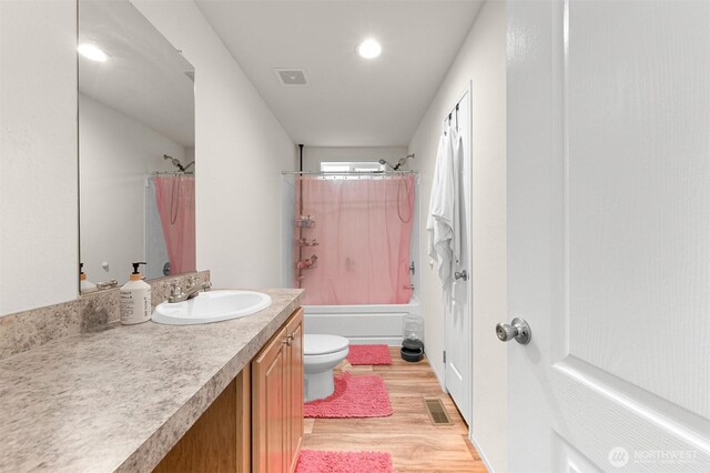 8450 Hazel Ct, Maple Falls, WA 98266 - bathroom featuring vanity, wood finished floors, and shower / bath combination with curtain