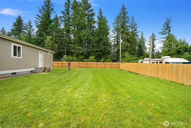 8450 Hazel Ct, Maple Falls, WA 98266 - fenced backyard featuring entry steps and view of scattered trees