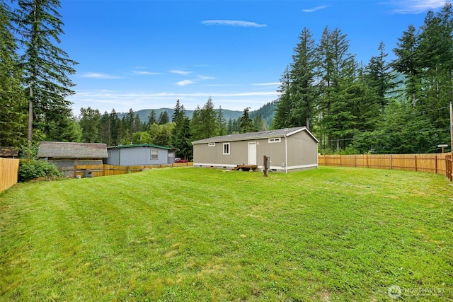 8450 Hazel Ct, Maple Falls, WA 98266 - fenced backyard featuring a mountain view and an outdoor structure