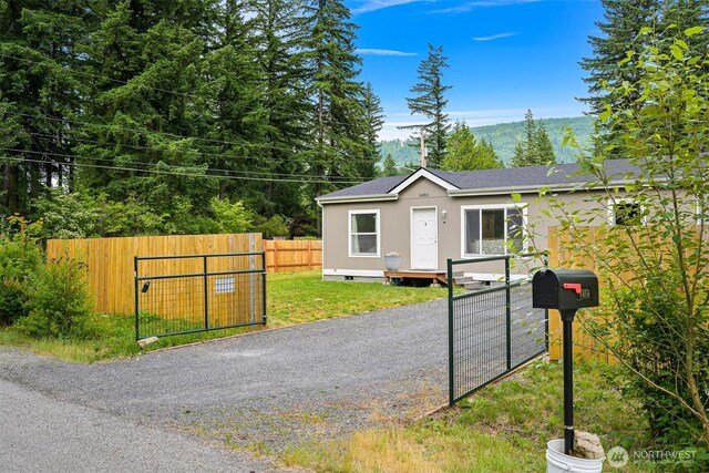 8450 Hazel Ct, Maple Falls, WA 98266 - view of front facade featuring a gate and roof with shingles