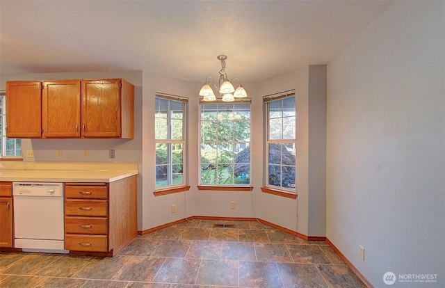10010 NE 76th Cir, Vancouver, WA 98662 - kitchen featuring a chandelier, white dishwasher, light countertops, brown cabinets, and pendant lighting