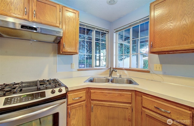 10010 NE 76th Cir, Vancouver, WA 98662 - kitchen with stainless steel gas range, light countertops, and under cabinet range hood