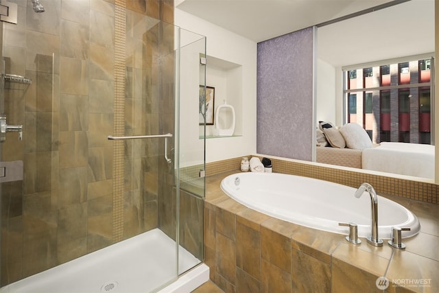 2033 2nd Ave Unit 703, Seattle, WA 98121 - bathroom featuring a garden tub and a shower stall