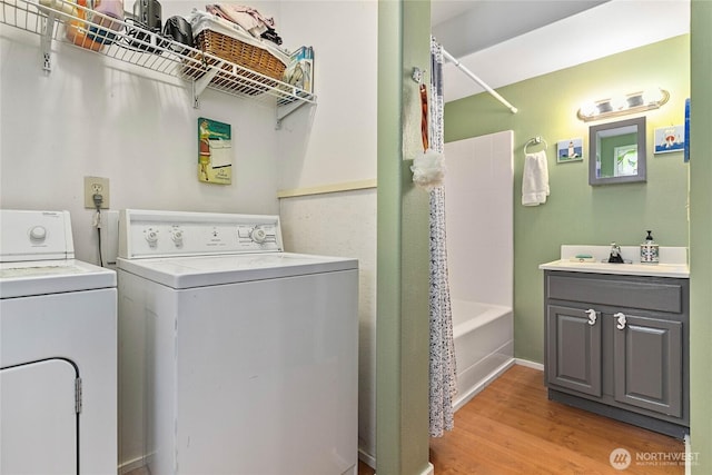 7005 Helweg Ln, Blaine, WA 98230 - laundry area featuring washing machine and clothes dryer and light wood finished floors
