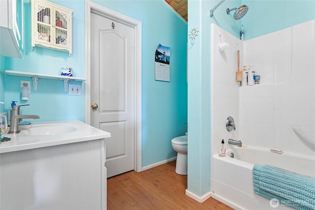 7005 Helweg Ln, Blaine, WA 98230 - full bathroom with toilet, wood finished floors,  shower combination, vanity, and baseboards