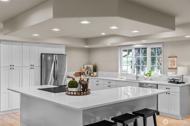 4680 State Route 6, Chehalis, WA 98532 - kitchen featuring stainless steel appliances, a sink, white cabinets, light wood-style flooring, and recessed lighting