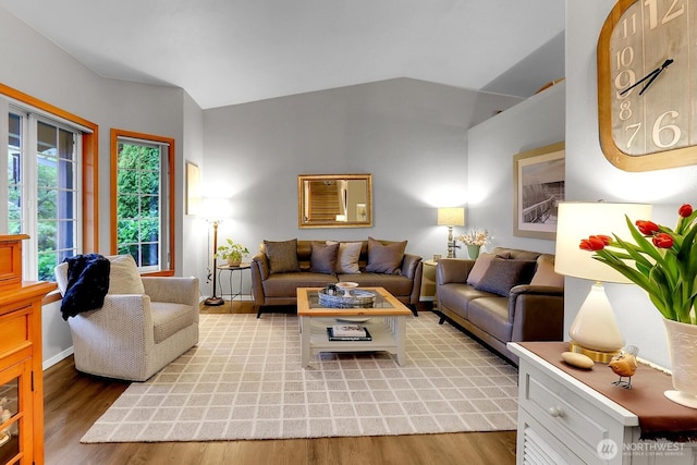 4421 166th Ave E, Lake Tapps, WA 98391 - living area with lofted ceiling, light wood-style floors, and baseboards