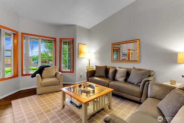 4421 166th Ave E, Lake Tapps, WA 98391 - living area featuring wood finished floors, baseboards, and vaulted ceiling