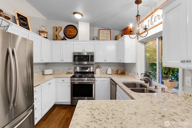 4421 166th Ave E, Lake Tapps, WA 98391 - kitchen with appliances with stainless steel finishes, a sink, white cabinets, and vaulted ceiling