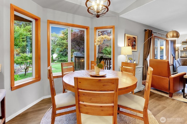 4421 166th Ave E, Lake Tapps, WA 98391 - dining room with a chandelier, wood finished floors, and baseboards