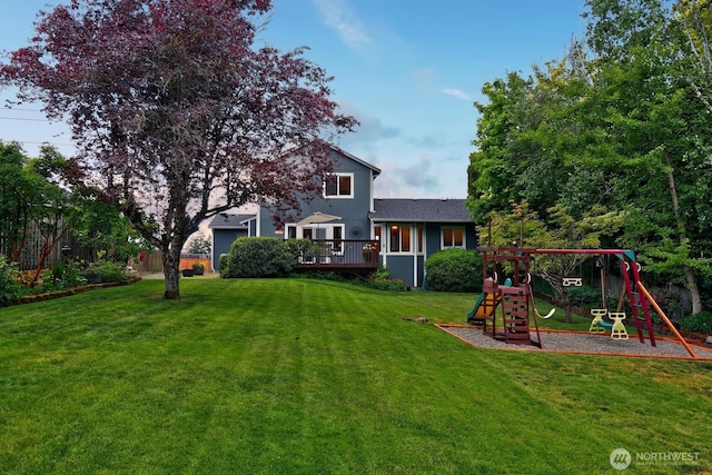 4421 166th Ave E, Lake Tapps, WA 98391 - view of grassy yard featuring a playground and a deck