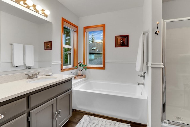 4421 166th Ave E, Lake Tapps, WA 98391 - full bath with vanity, a garden tub, a shower stall, and wood finished floors