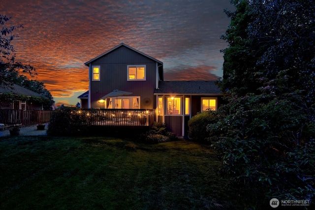 4421 166th Ave E, Lake Tapps, WA 98391 - back of house at dusk featuring a deck