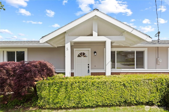 26908 NE Stewart St, Duvall, WA 98019 - view of exterior entry with roof with shingles and stucco siding