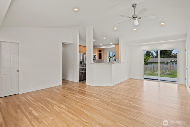 26908 NE Stewart St, Duvall, WA 98019 - unfurnished living room featuring vaulted ceiling, recessed lighting, light wood-type flooring, baseboards, and ceiling fan