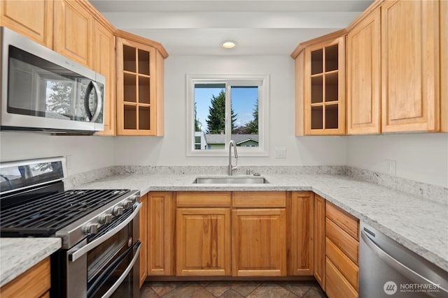 26908 NE Stewart St, Duvall, WA 98019 - kitchen featuring appliances with stainless steel finishes, a sink, glass insert cabinets, light stone counters, and recessed lighting