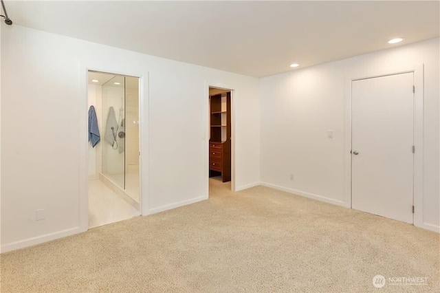 1360 Colchester Dr SE, Port Orchard, WA 98366 - unfurnished bedroom with carpet flooring, recessed lighting, a spacious closet, baseboards, and connected bathroom