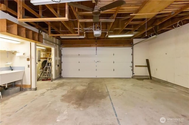 1360 Colchester Dr SE, Port Orchard, WA 98366 - garage featuring a sink, a garage door opener, and electric panel
